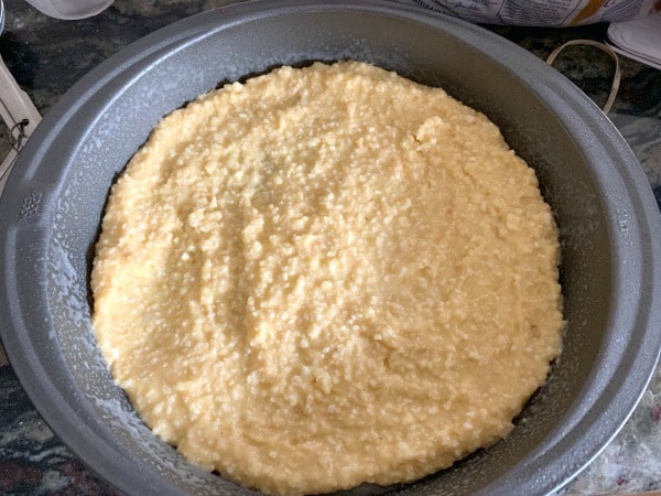 Matzo meal cake batter in a cake pan.