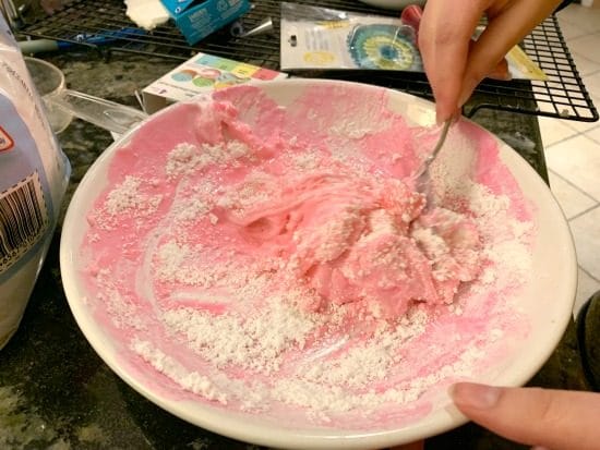 A bowl of melted peeps and powdered sugar.