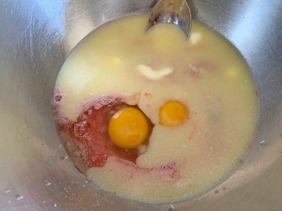 The strawberry cake wet ingredients in a bowl.