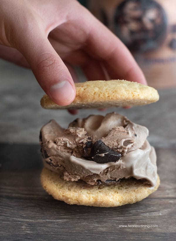 Making an ice cream sandwich with chocolate ice cream.