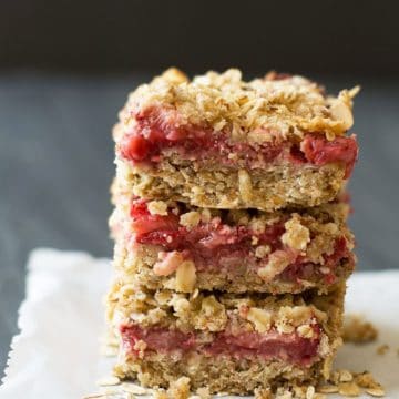 A stack of three gluten free strawberry oatmeal bars.