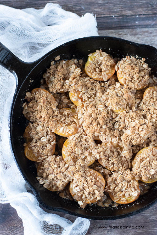 An apricot crisp in a cast iron skillet.