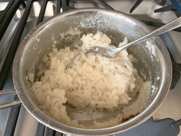 Gluten free churro dough in a pot.