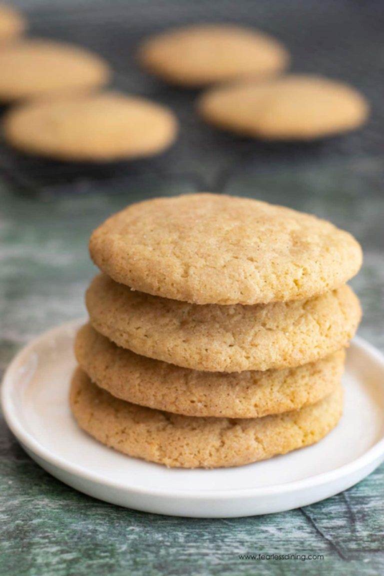 A stack of four gluten free snickerdoodles on a plate.