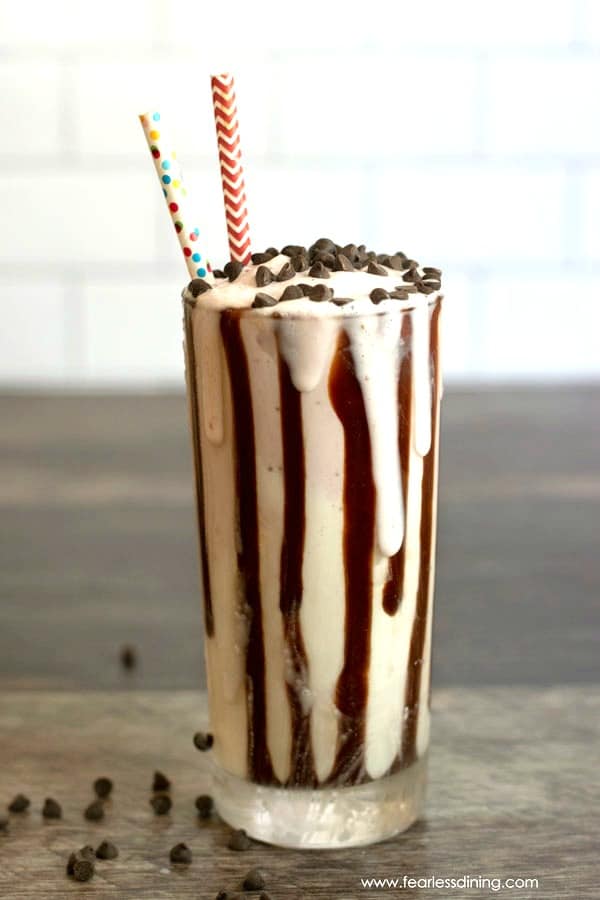 ombre milkshake with hot fudge stripes in a tall glass.