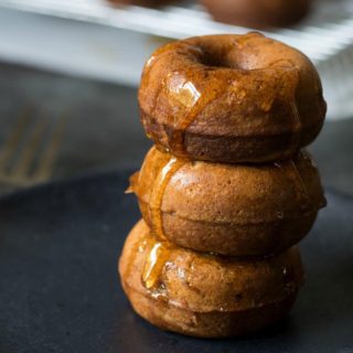 a stack of cinnamon apple donuts on a plate