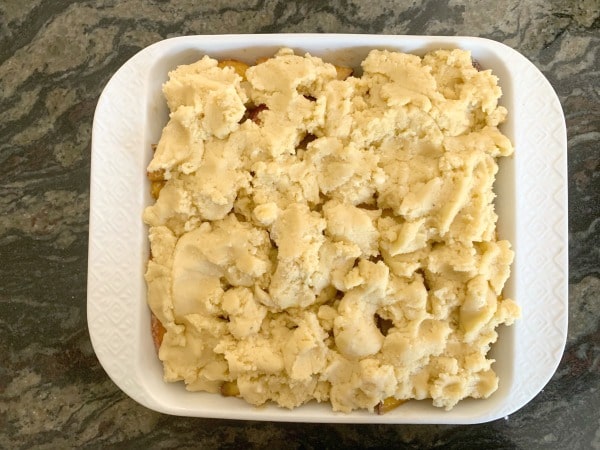 The almond flour peach cobbler ready to bake.