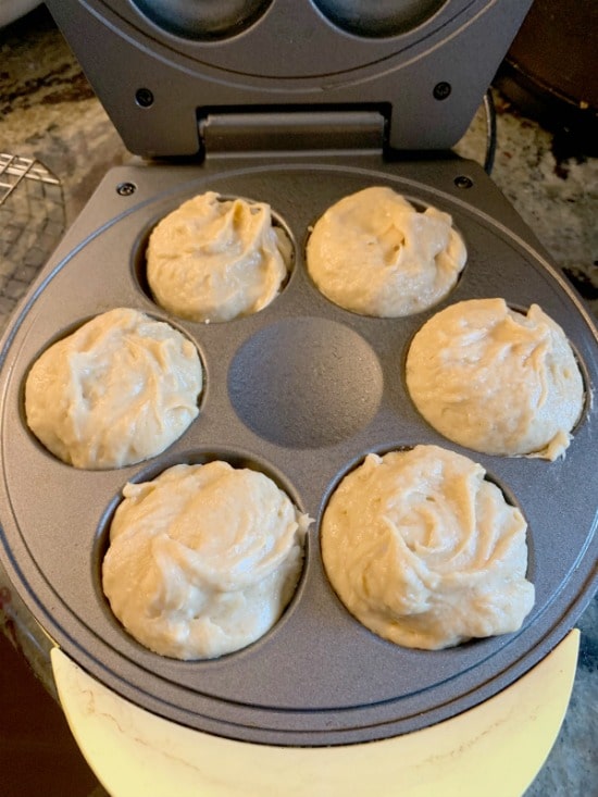 Some donut batter in a donut maker.