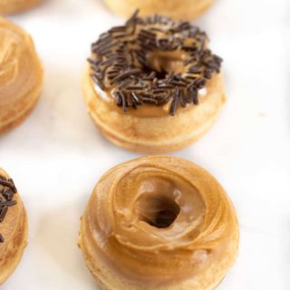 Rows of mini gluten free peanut butter donuts.