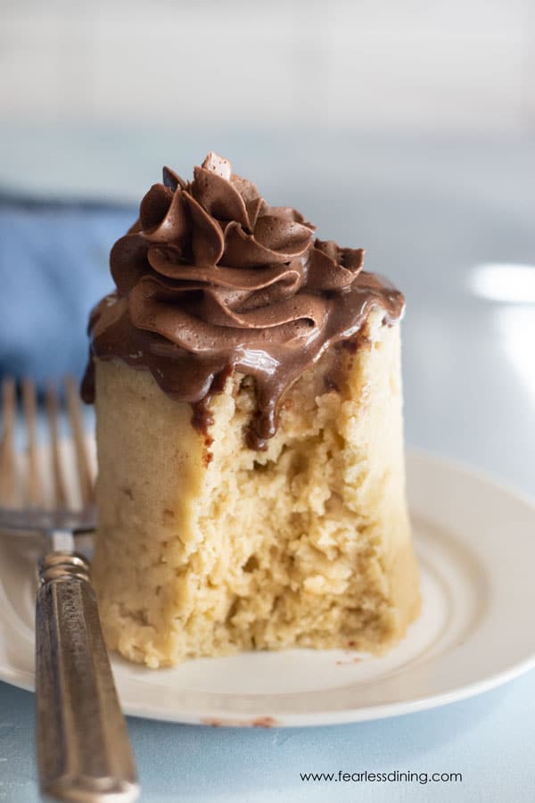 Another picture of a mug cake with a bite taken out.