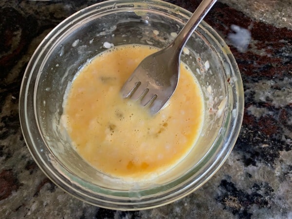 Wet ingredients for the mug cake in a bowl.