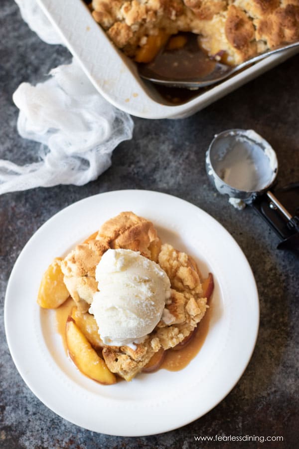 The top view of a plate full of paleo peach cobbler.