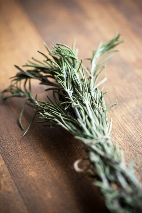 A bunch of rosemary tied with a string.