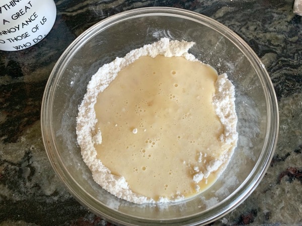 The wet and dry ingredients in a bowl.