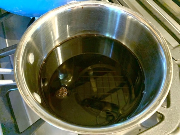 A saucepan filled with balsamic vinegar on the stove.