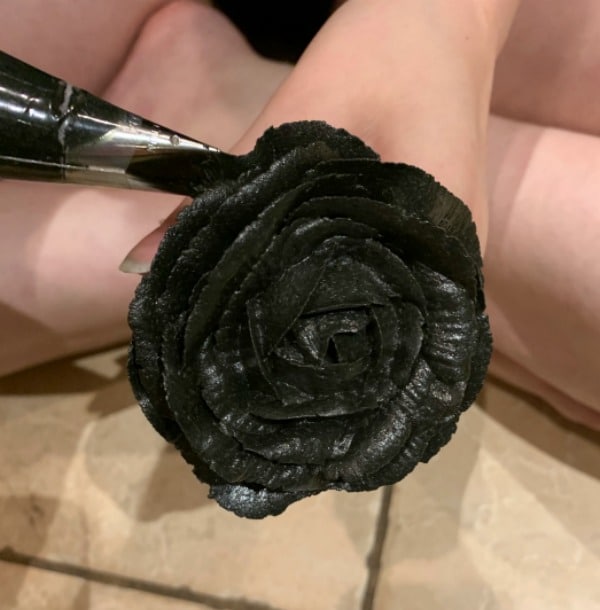 Making more black frosting rose petals.