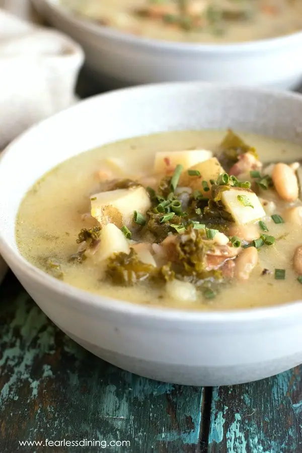 two bowls of potato kale soup