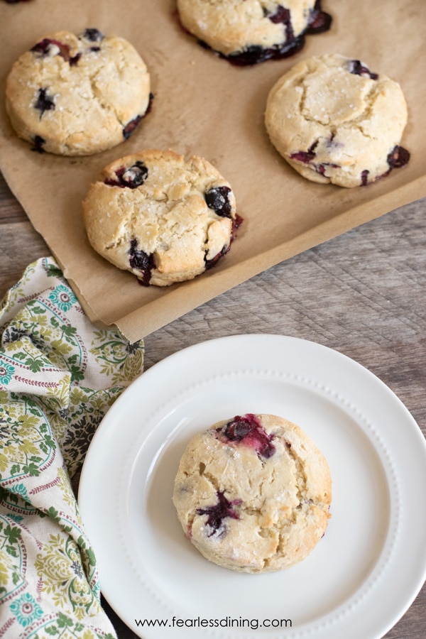 The top view of the baked scones. One is on a small white plate.