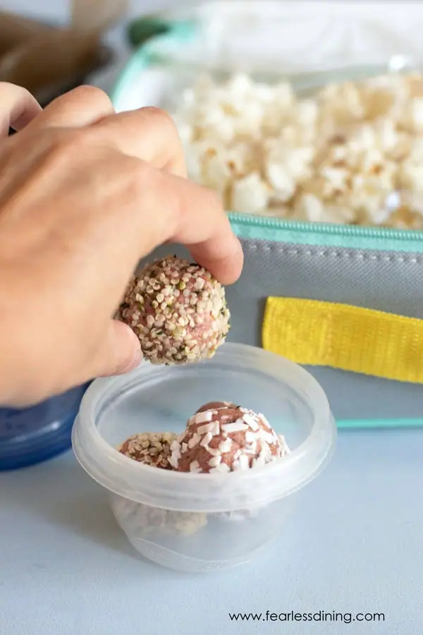 packing gluten free energy balls into a school lunchbox