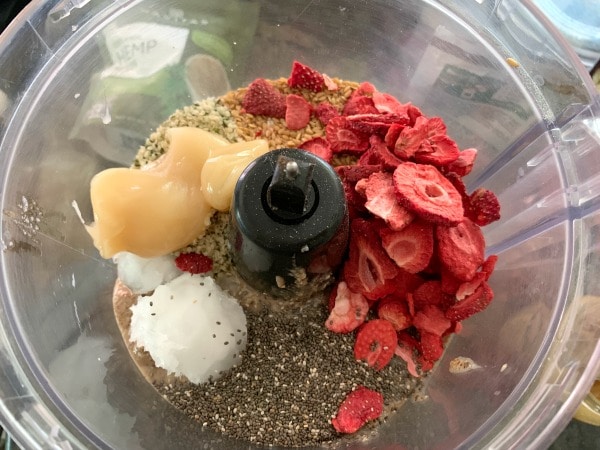 ingredients in a food processor ready to grind.