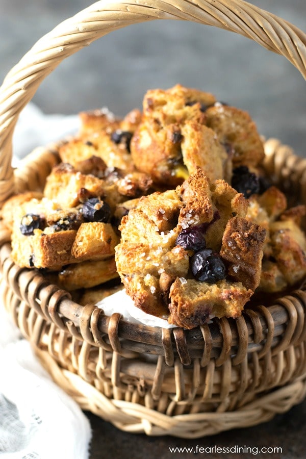 A basket of gluten free blueberry French toast muffins.