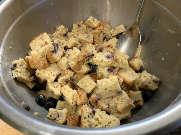 Egg mixture stirred into the bread cubes.