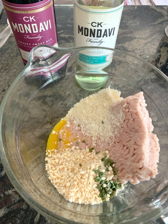 Ground chicken burgers ingredients in a bowl.