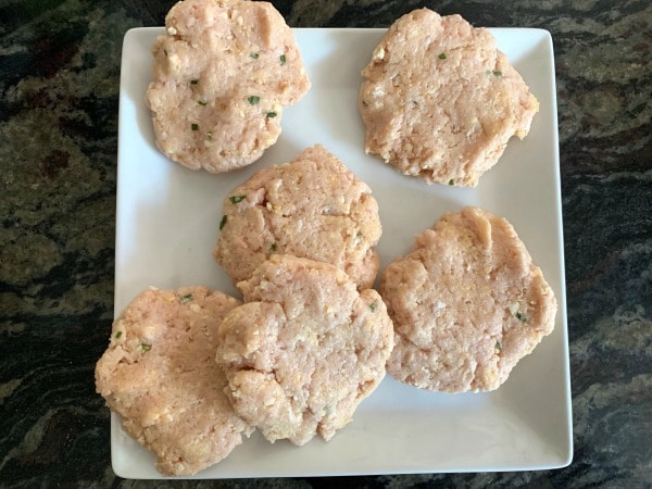 Ground chicken burgers ready to grill.