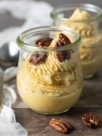 jars of pumpkin mousse topped with candied pecans