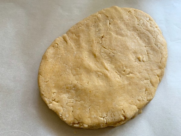 Shaping the biscotti dough on a piece of parchment paper.