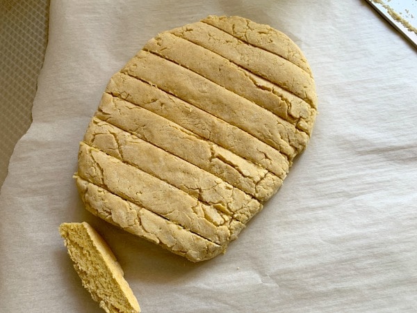 Slicing the partially baked biscotti.