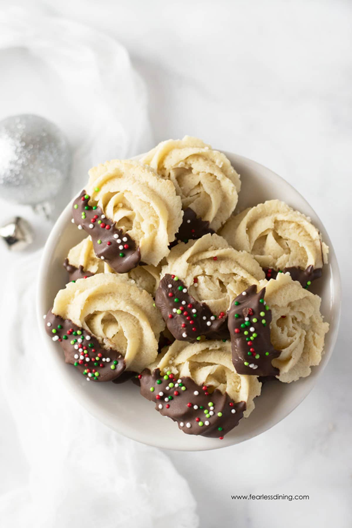 A bowl of decorated butter cookies.