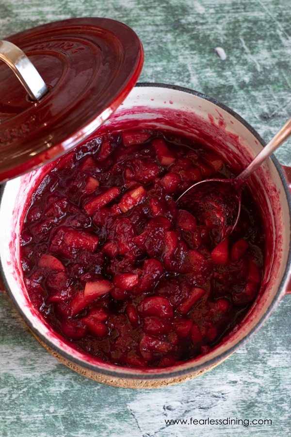 a red pot of homemade cranberry sauce