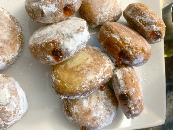 a plate full of gluten free jelly donuts