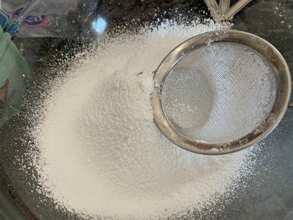 sifting powdered sugar
