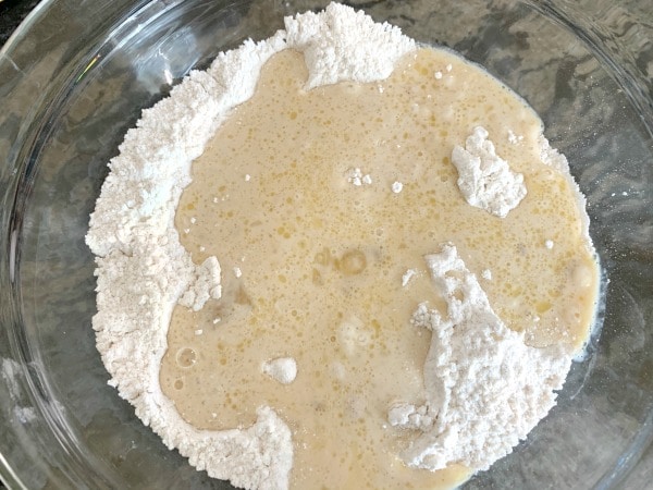 The sufganiyot wet and dry ingredients in a bowl.