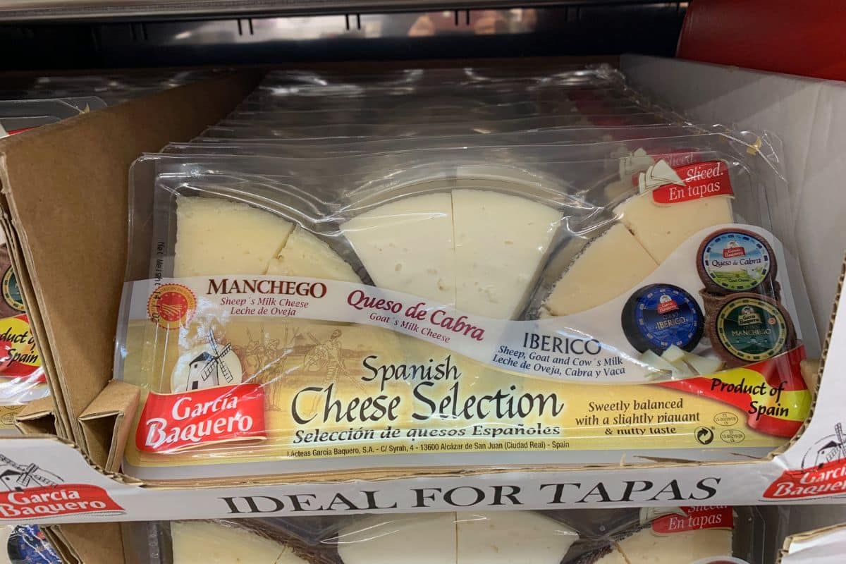 A Costco package of pre-cut Spanish cheeses.