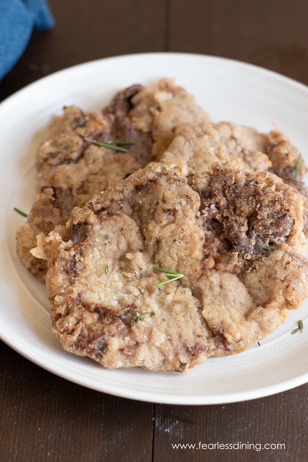 A plate of gluten free chicken fried steak pieces.