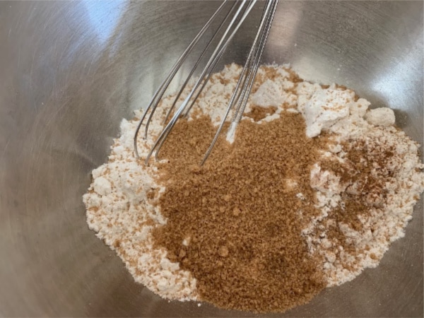 The gluten free date nut cake dry ingredients in a bowl.