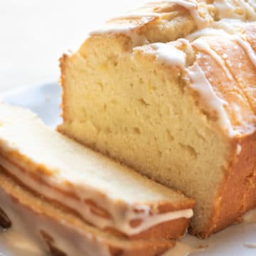 A sliced gluten free lemon pound cake on a platter.