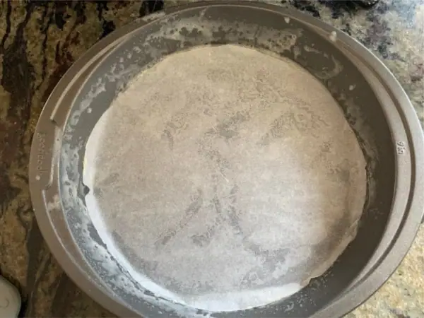 a cake pan lined with parchment paper