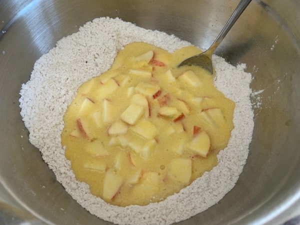 Pouring the wet ingredients into the dry ingredients.