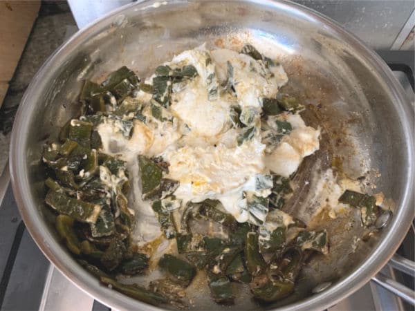 Cooking poblanos with cream cheese.