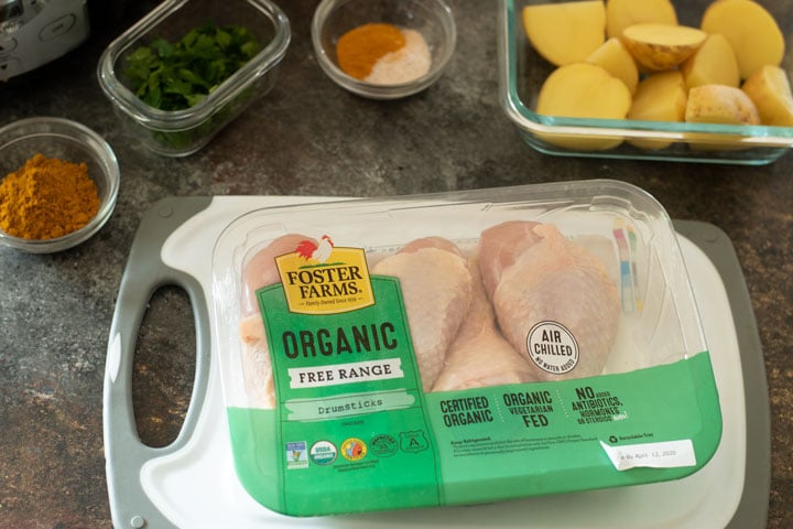 A package of chicken on a cutting board.