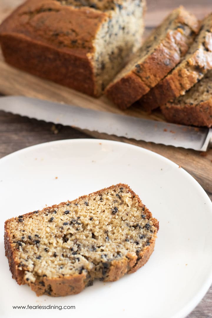 A slice of black sesame banana bread on a plate.