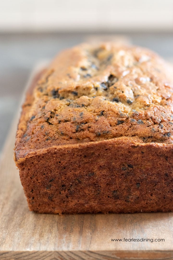 The front view of a whole loaf of banana sesame bread.