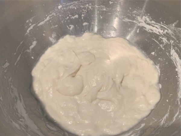 Starter dough rising in a bowl