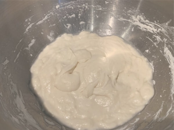 Sourdough starter rising in a bowl.