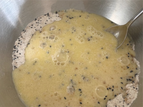 Wet and dry ingredients in a bowl ready to mix
