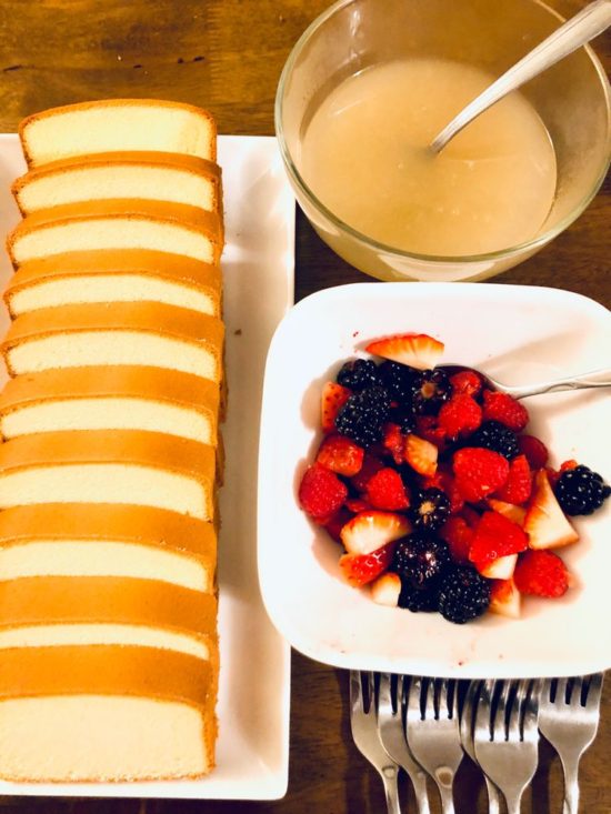 Reader Jax's photo of finished cream sauce next to a bowl of cut fruit and cake.